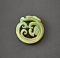 (#737) A CELADON JADE ‘DRAGON’ PENDANT PROBABLY WESTERN HAN DYNASTY