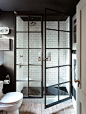 White subway tile and black glass doors.