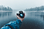 Reflection of Man Photographing in Snow