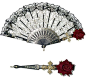 an ornately decorated fan with red roses on the side and a decorative rose attached to it
