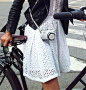 I don't agree with bike riding in a dress, but this white eyelet dress + black leather jacket is fab