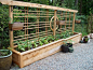 Beautiful raised bed with built-in trellis from Gabriola Girl blog