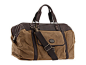 蛮好看的一款帆布旅行包，美国品牌 FOSSIL 在 2012 年最新推出的 Estate Duffle 旅行包，粗帆布配皮革饰边，更经踹，更耐用。