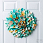 Make a creative and unique Easter wreath with our design for our vibrant craft made from rolled scrapbooking paper.   Make the Easter Door Decoration: Select several sheets of patterned scrapbooking paper in pastel colors (we chose yellow and teal for our