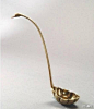唐代的鎏金錾花九曲银勺，勺首处还被巧妙地制成了鸟形，栩栩如生