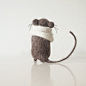 Gray mouse in white knitted scarf, domisticated little friend, playful and loving rodent pet handmade from organic wool的图片