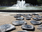 Ripples : The concentric rings, carved on random stone slabs, echo the ripples formed as