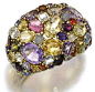 Gem-set bangle, 1960’s. Gemstones include: amethysts, citrines, garnets, and sapphires.