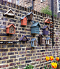 A wall of insect hotels. A selection of insect hotels can be found at www.thegrowingobsession.co.uk