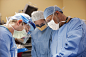 Photograph Surgeons operating in operating room by Gable Denims on 500px