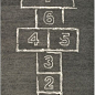 Hopscotch Rug - This hopscotch rug adds just the right amount of fun to any space. Plus, it would be the perfect game on a rainy day. Who's in?