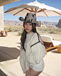 Photo by MILLY KIRN on May 02, 2024. May be an image of 1 person, hat, headdress and parasol.