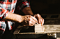 Cropped hand of a carpenter taking measurement of a wooden plank by Lazar Obradovic on 500px