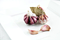 Purple garlic on white plate by Eduardo Lopez on 500px