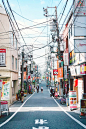 A small street with a bunch of power lines in Shinjuku，Japan
