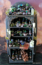 A miniature witch's potion cupboard.