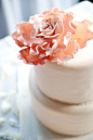 Elegant cake topped off with one big bloom icing..