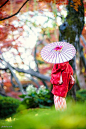 Japanese woman in kimono with umbrella