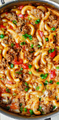 One-Skillet Mac and Cheese with Sausage and Bell Peppers, smothered in marinara sauce and cream. Everything is cooked in one skillet: sausage, bell peppers, and even pasta! Comfort food!: 