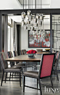 The dining room of a NY-style Miami waterfront. Cool lighting. Chandelier. Silver chairs.: 
