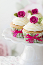 Cute little fuchsia flower topped cupcakes