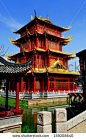 CHENGDU, CHINA: The striking red and gold dragon pagoda with its gilded flying eaves at the Long Tan Water Town - stock photo