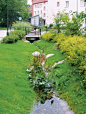 Ditches can be integrated into green verges or the roadside. They look natural but do need extra space and maintenance. Click on this link http://www.urbangreenbluegrids.com/measures/ for more green streetscaping via Atelier GroenBlauw and visit the Slow 