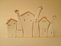 Ceramic houses in a row, pretty cute. ARTIST???