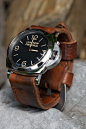 Love the black dial and thick brown strap on this Panerai 372.