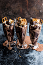 Salted pretzel nutella fudge milkshake with malted milk whipped cream