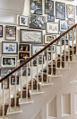 stairway gallery wall ... colourful collection of posters, drawings and photos from an English actor's career unified by plain narrow frames in black or silver, white or grey mattes: 