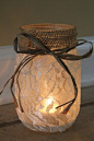 Lace and burlap jars with tea lights.