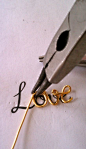making a LOVE necklace :)
