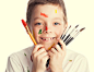 Child with paintbrush