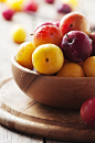 Yellow and red sweet plums on the wooden table by Oxana Denezhkina on 500px