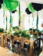 Vintage woodland birthday party with green + black balloons: 