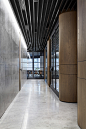 Luxury materials bring hotel feel to headquarters of PDG property developers : Studio Tate has revamped the 17th floor of an unusual hexagonal building to create lavish offices for PDG, a property development firm based in Melbourne.