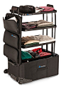 A suitcase with built-in shelves! I need one of these.. It will be so helpful when packing our clothes:): 