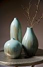 Abydos Medium Vase - The beautiful reactive glaze used on this ceramic vase serves to accentuate its fluid lines and minimalist form. For a coordinated look purchase all three sizes. IMAX exclusive!