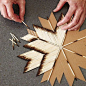 DIY craft on Simply Grove.  Hot glue already-lit matches to a card bord cut-out. use toothpicks?