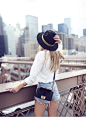 white shirt. cutoffs. hat.: 