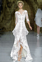 Brides.com: Our Favorite Lace Wedding Dresses from the Bridal Runways. "Yaela" lace A-line wedding dress with a layered high-low skirt, v-neckline, and three-quarter sleeves, Pronovias  See more Pronovias wedding dresses.