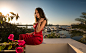 People 2048x1264 women model brunette touching hair looking at viewer watch portrait side view cleavage dress red dress sunlight bokeh balcony sea sky yachts horizon outdoors sitting women outdoors Ivan Gorokhov