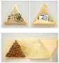 日本的设计都很简洁，回归自然，这是用薄木片纹样的纳豆包装。呈三角形状。