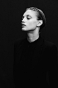 Women in black suit, fashion editorial, black and white photography: 