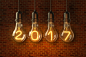 创意图片2017数字灯泡里的2017新年新年创意素材新年素材发光的灯泡灯泡生活用品高清图片