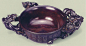 2、紫檀双螭杯•清朝•中期
此杯系一木雕成，杯形圆中略扁，内壁打磨光滑。外壁镶嵌银丝铭文，是清代中早期的工艺特色，水平极高。