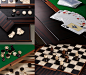 Cards, wooden dominoes, checkers, chess and dice from Bassano da gioco, wooden gaming table with bronze base equipped for several board games, from Promemoria's catalogue | Promemoria