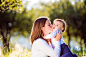 Mother, sitting on the grass, kissing her little son by Jozef Polc on 500px