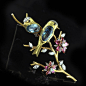 Pair of aquamarine and diamond birds perched on a yellow gold branch with pink tourmaline and diamond floral clusters E Wolfe London circa 1973